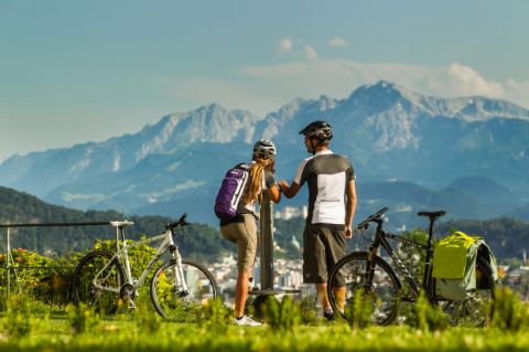 Two cyclists in front of panoramic view