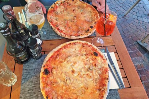 Eating pizza in Merano
