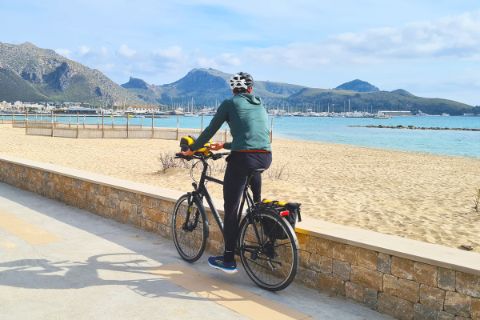 Cyclists on the beach in Port Pollenca