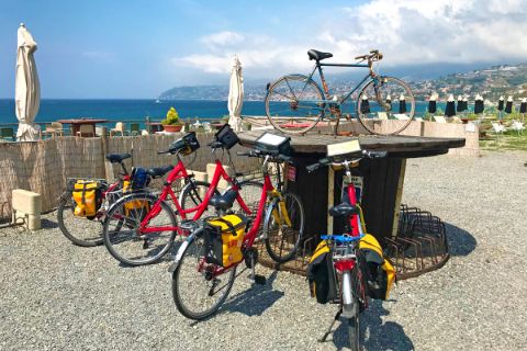 Bikes at a kickstand along the coast