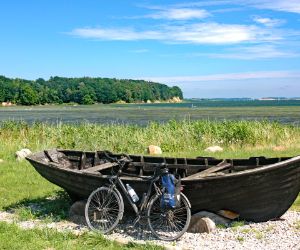 Bike in front of boat at the Baltic sea