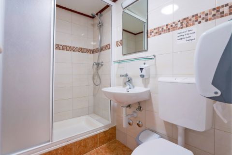 Boothroom with shower and toilet