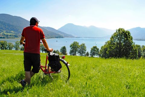 Cyclist looking to a lake