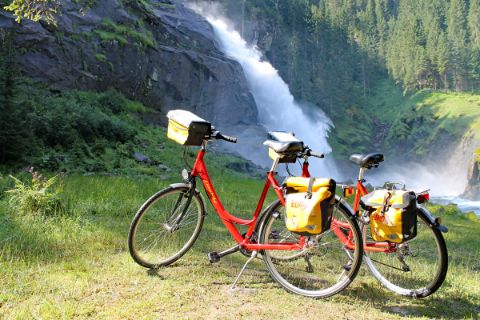 Two Eurobike-bikes in front of the waterfalls of Krimml