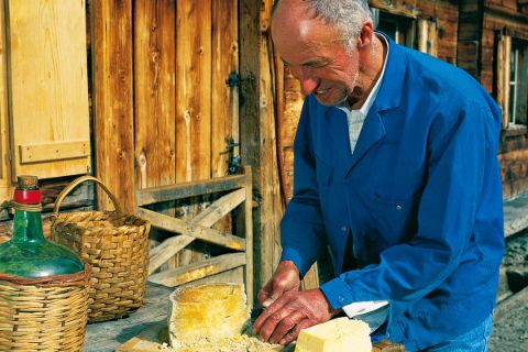 Man cuts cheese