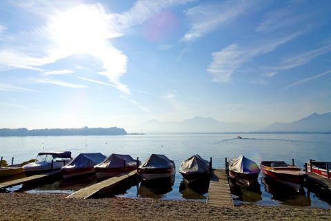 Boats on the riverside of the lake chiemsee