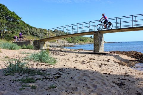 Cycle path over a bridge by the sea