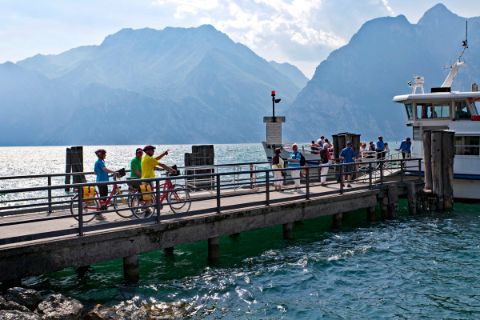 Cyclists going to the ferry at Lake Garda