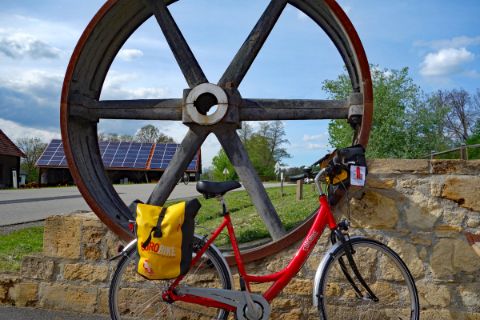 Eurobike-bike in front of wooden wheel