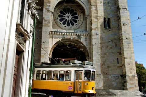 Old tram in front of the Sé Cathedral in Lisbon