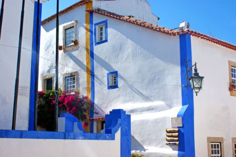 Typical white and blue house in the coastal region of Obidos