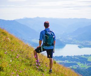 Hiker with a view of the landscape in the Salzkammergut