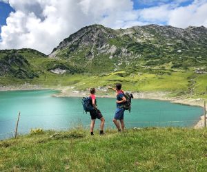 Hikers at the Formarinsee lake in Lech am Arlberg 