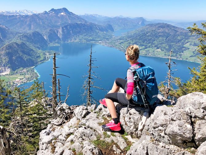 Hiker with panoramic view of lake Attersee