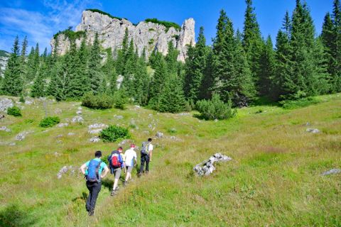 Group of hikers on a high-altitude trail in Durmitor mountains