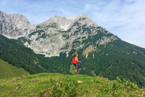 Hiker in front of Wilder Kaiser mountain
