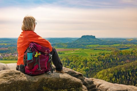 Hiker on the Malerweg with a view of Saxon Switzerland