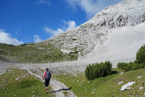 Hiker on stony hiking trail in the direction of Lafatscherjoch