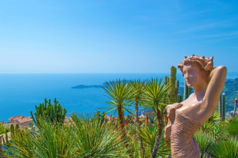 Enjoy wide views of palm trees, mountain villages and the sea from a female statue
