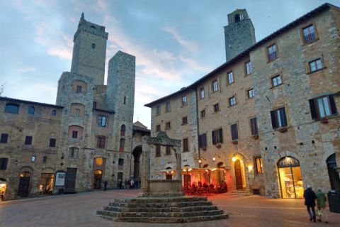 The fountain square in San Gimignano at the evening hour