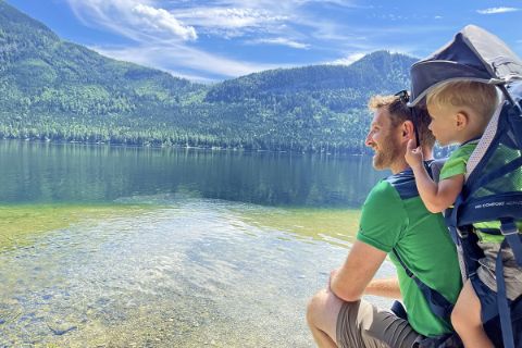 Father and son with view of Altaussee lake