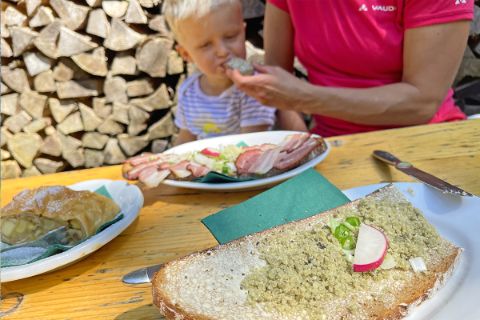 Family snack with typical Steirerkas bread in the Koppental valley