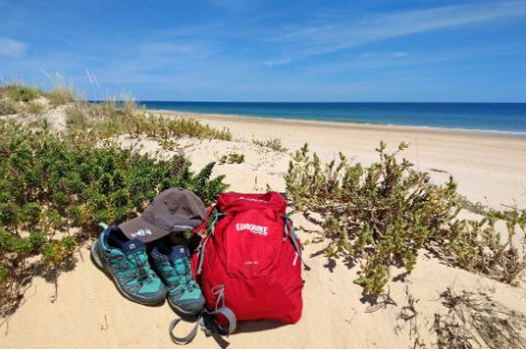 Hiking equipment on the beach of the Algarve