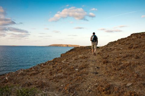 Hiker at costal paths in Menorca