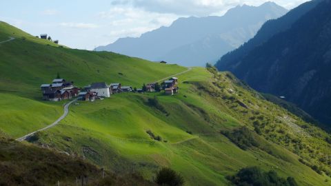 A tiny village is located in the mountains on the Alpine Passes Trail.