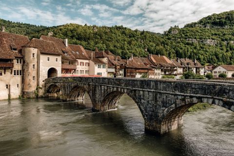 Cross the bridge into the medieval town of St. Ursanne.