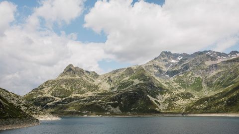 Mountain lake in Splunga with panorama